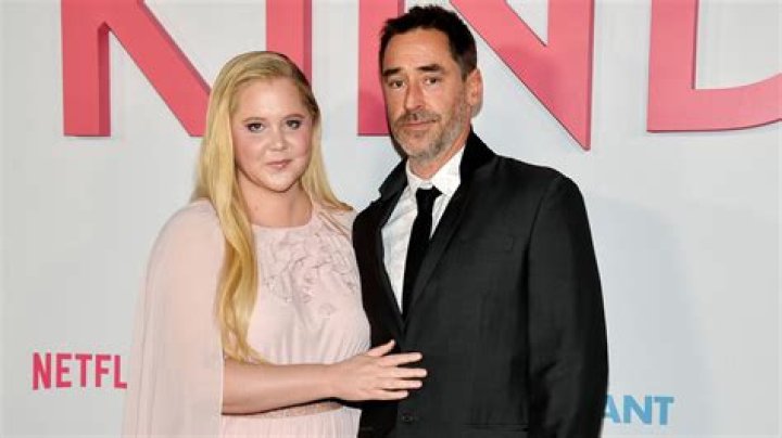 Amy Schumer & Husband Chris Fischer Kiss On Her 41st Birthday In Rare PDA Photos