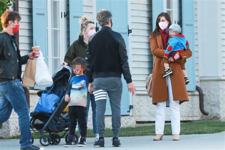 Anne Hathaway Carries Son Jack, 1, In Rare Family Outing With Husband & Older Son Jonathan, 5