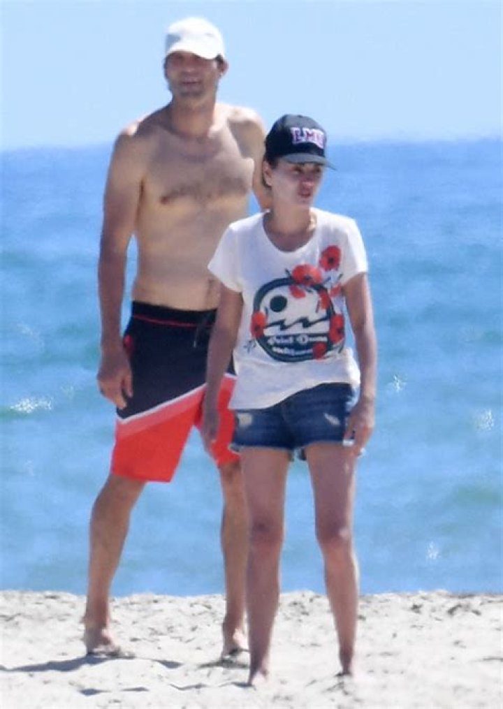 Ashton Kutcher Plays Football On The Beach Shirtless With Mila Kunis After Health Scare