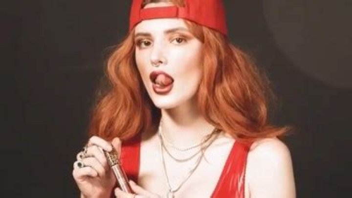 Bella Thorne Wears Red Latex Thong, Bra & Thigh-High Boots In Video – Hollywood Life