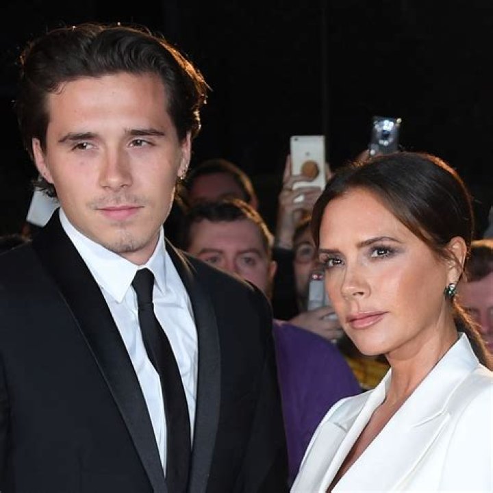 Brooklyn Beckham Carries & Kisses Baby Sister Harper In LA — So Sweet