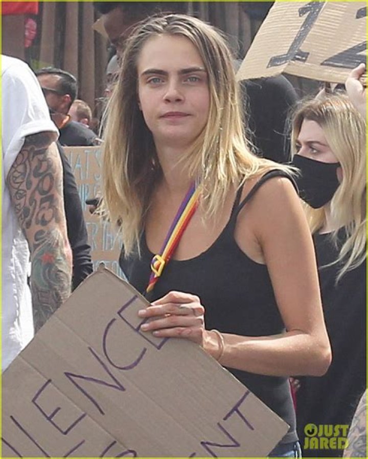Cara Delevingne, MGK & Travis Barker Protest & Hold Empowering Signs Together In LA