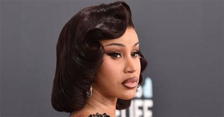 Cardi B Flaunts Cleavage In Skimpy Bra Top As She Rocks Neon Blue Wig – See Pic