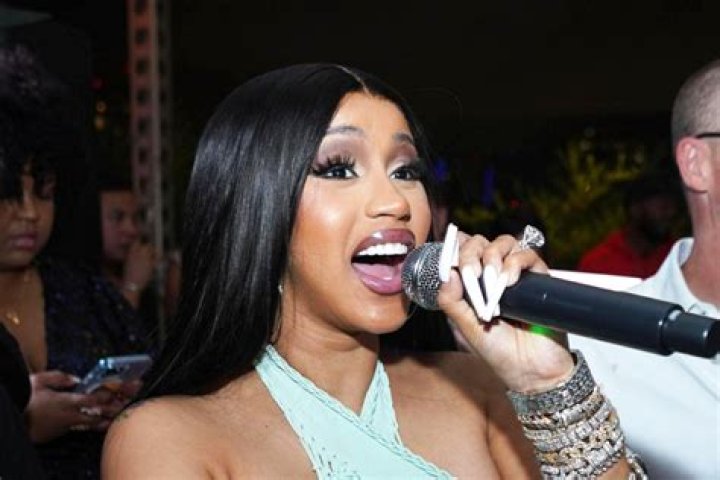 Cardi B Sizzles In Sparkly Purple Bodysuit & Fishnets At BET Experience 1 Day After Indictment – Pics