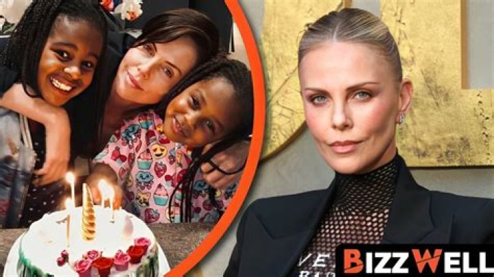Charlize Theron Cuddles Daughter Jackson In Rare, Intimate Photo From ‘Mad Max’ Set