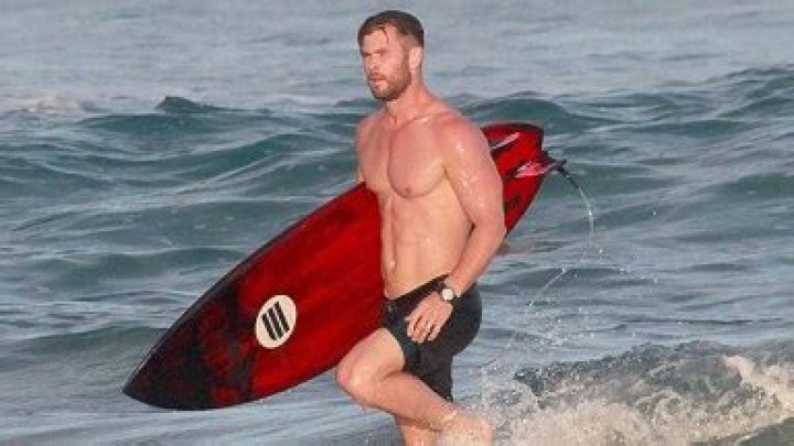 Chris Hemsworth, 39, Goes Shirtless As He Surfs With Twins Tristan & Sasha, 8, In Australia: Photos
