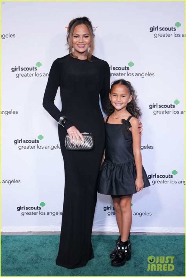Chrissy Teigen’s Daughter Luna, 5, Hilariously Hides Under Her Gown At VAX Live Concert — Pics