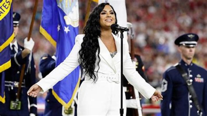Demi Lovato Flawlessly Performs National Anthem Wearing Stylish, All-White Suit During Super Bowl