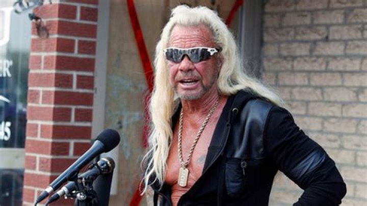 Dog The Bounty Hunter Holds Up Newspaper To Prove He’s ‘Alive’ After Rumors He Had A 2nd Pulmonary Embolism
