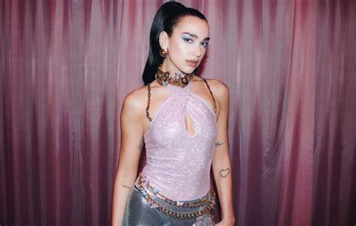 Dua Lipa Hits Las Vegas Stage In Neon Catsuit & Gloves: Photos – Hollywood Life