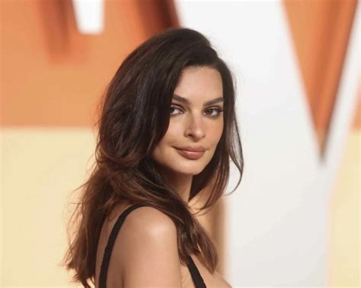 Emily Ratajkowski Rocks Insane Plunging Swimsuit In Sexy New Video