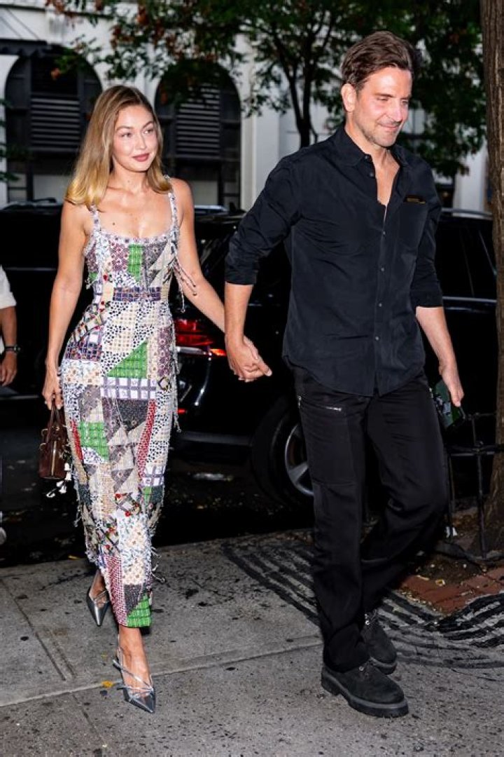 Gigi & Bella Hadid Hold Hands In Hot Pink & Black Outfits At The Prince’s Trust Gala