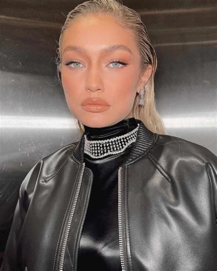 Gigi Hadid Looks Totally Unrecognizable With New Platinum Hair Slicked Back At Burberry Fashion Show