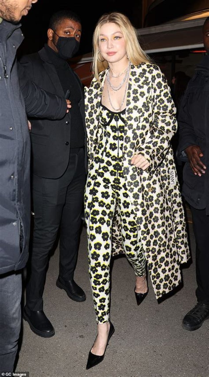 Gigi Hadid Stuns In Skintight Floral Jumpsuit & Matching Coat During Paris Fashion Week