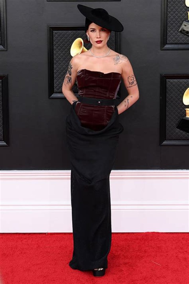Halsey Slays In Burgundy Leather Bustier & Black Skirt At GRAMMYs After Surgery: Photos