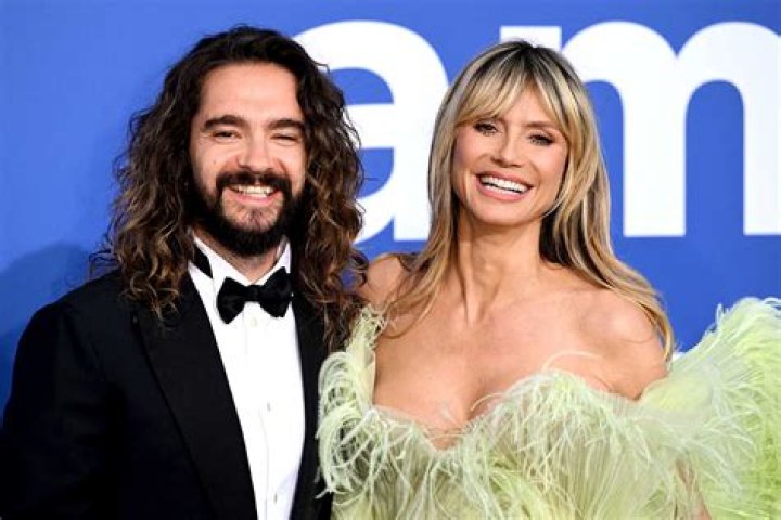 Heidi Klum Kisses Husband Tom Kaulitz Through A Glass As They Await COVID-19 Test Results