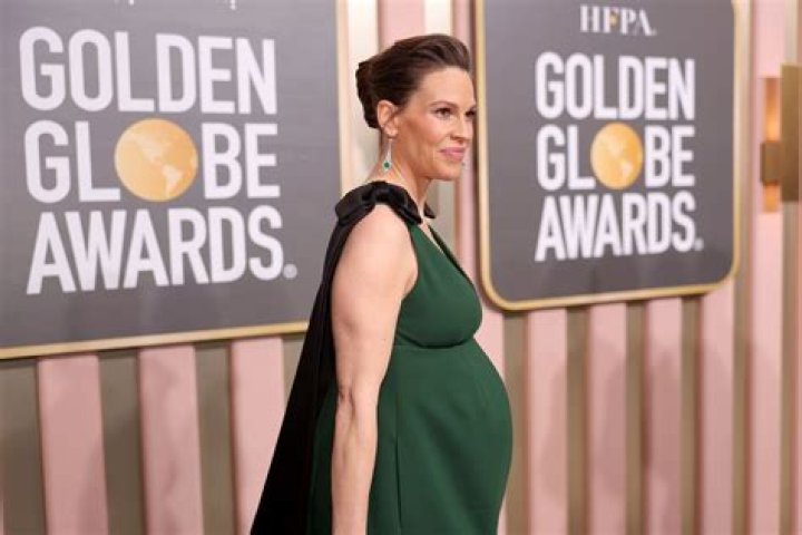 Hilary Swank Shows Off Growing Baby Bump While Decorating Tree – Hollywood Life