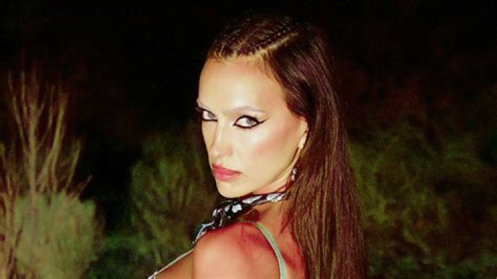 Irina Shayk Slays In Plunging Corset, Lingerie & Sheer Mini Skirt For Savage X Fenty Vol. 4 Fashion Show