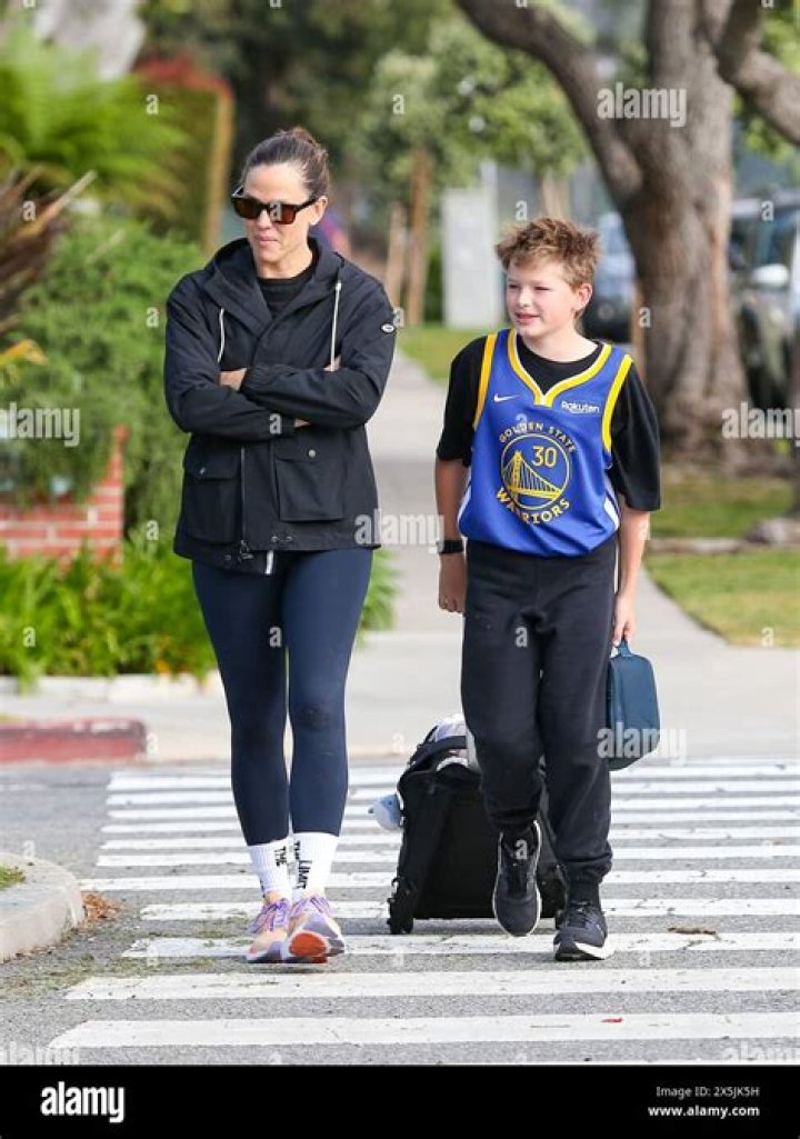 Jennifer Garner Holds Hands With Son Samuel, 10, As She Returns To LA After NYC Trip