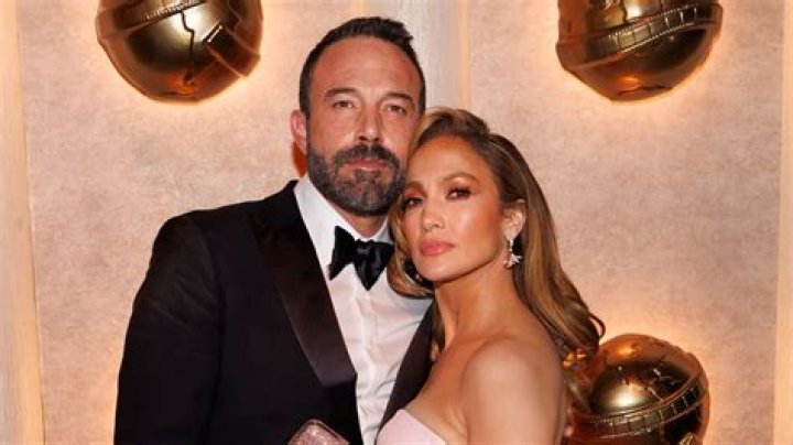 Jennifer Lopez Reveals Toned Abs In Strapless Beige Bandeau Top & Matching Pantsuit — Photos