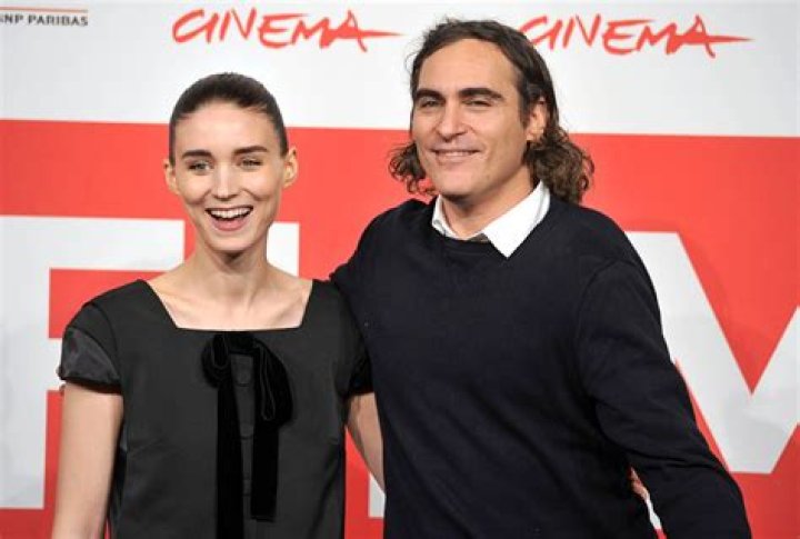 Joaquin Phoenix Wraps An Arm Around Rooney Mara As Couple Makes Rare Outing Together