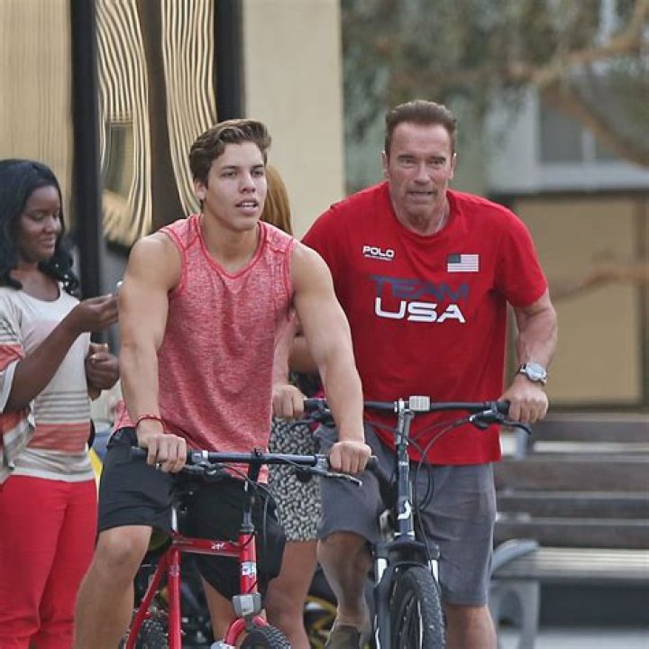 Joseph Baena, 23, Bonds With Dad Arnold Schwarzenegger On Venice Beach Bike Ride — See Pics