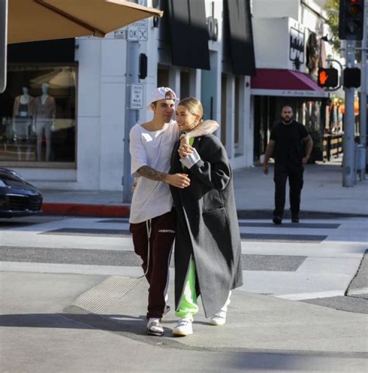 Justin Bieber & Hailey Baldwin Hold Hands & Makeout On The Street During Stroll — Pics