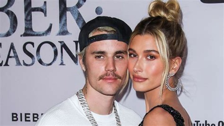 Justin & Hailey Bieber Cuddle Close & Kiss in Rare PDA Photos: ‘We’re Cute’