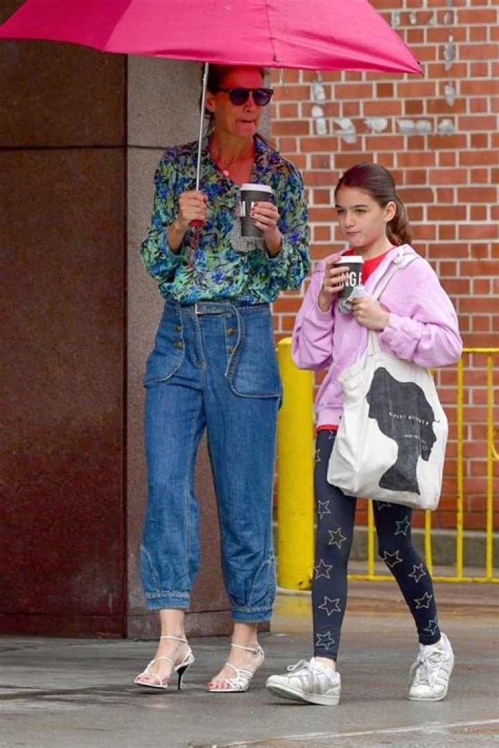 Katie Holmes Strolls Through The Rain With Look-Alike Daughter, Suri, 13, In NYC