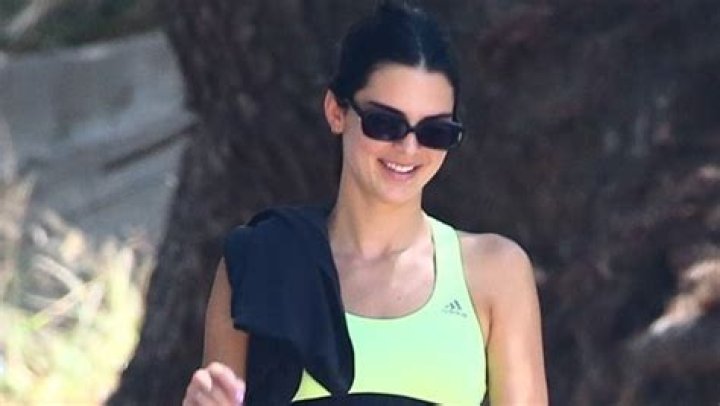 Kendall Jenner Shows Off Her Toned Abs In Athletic Crop Top & Spandex Shorts — Pic
