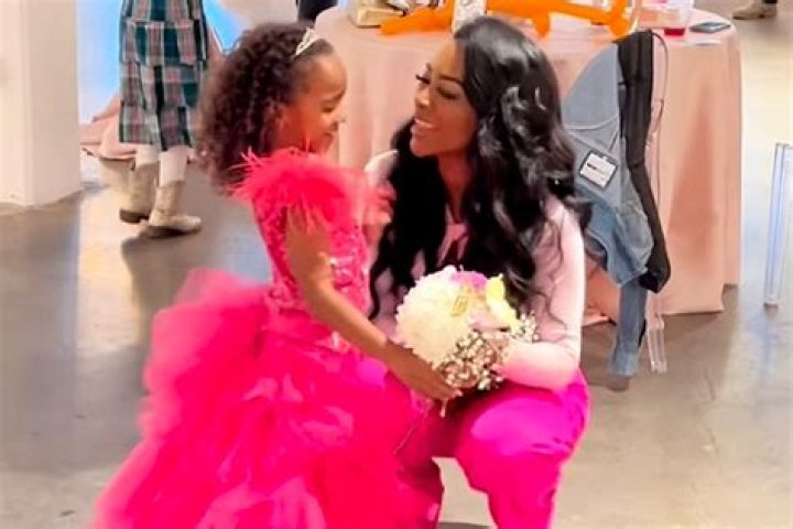 Kenya Moore’s Daughter Brooklyn, 1, Tries To Go To NYC To See Daddy Marc In Adorable New Video