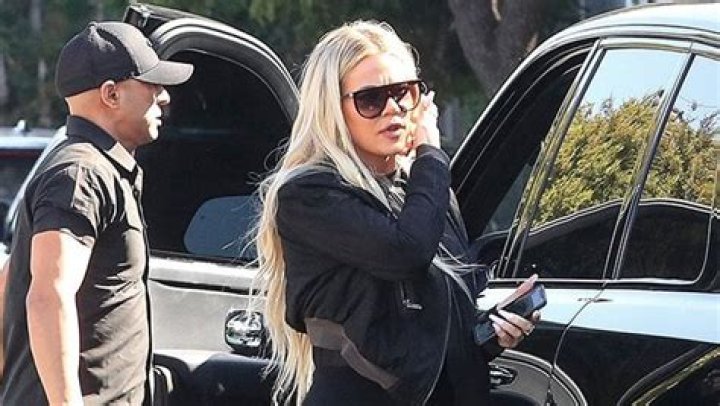 Khloe Kardashian Rocks A Face Full Of Makeup & Plunging Top For Sweaty 6AM Workout