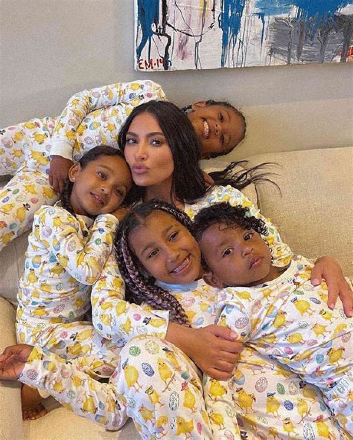 Kim Kardashian Shares Precious Pic Of Saint, Chicago, & Psalm Cuddled Together In Matching PJs