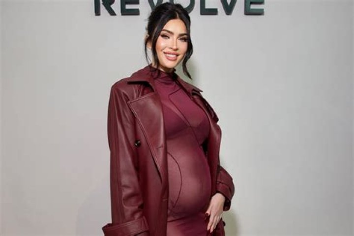 Kim Kardashian Shows Off Baby Bump In Tight Workout Outfit