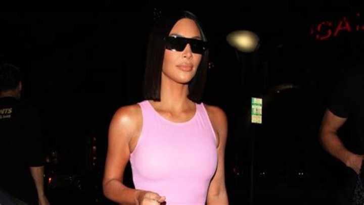 Kim Kardashian Slays In Pink Thong Bikini As She Licks Cake Frosting Off Her Fingers — Photos