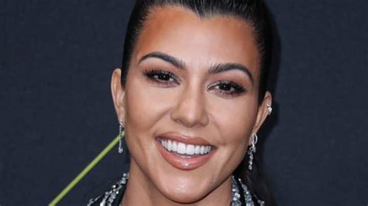 Kourtney Kardashian Channels A Mermaid By Wearing Bikini Top & Fins In The Pool