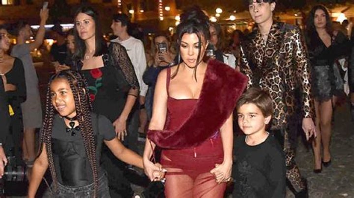 Kourtney Kardashian Rocks Sheer Red Dress As She Leads North West & Her Kids Into Dinner Party