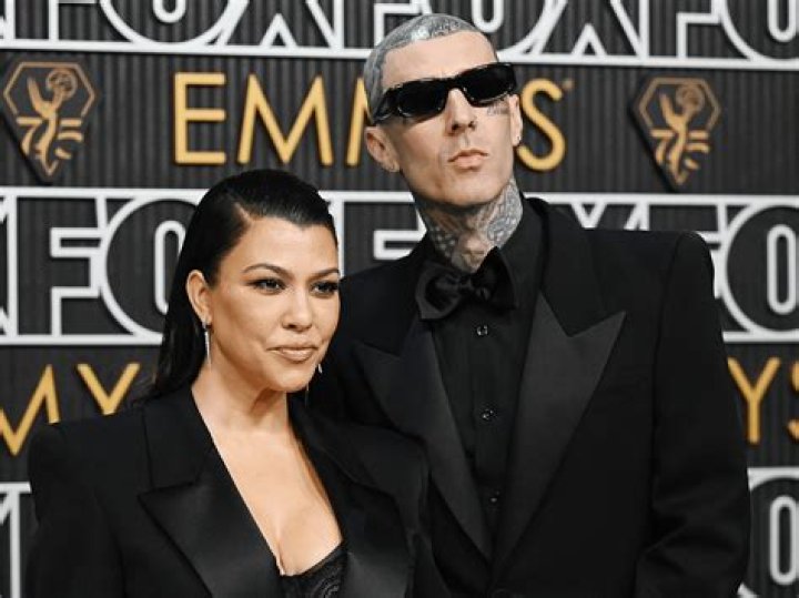 Kourtney Kardashian & Travis Barker Share A Steamy Kiss On Grammys Red Carpet: Photos