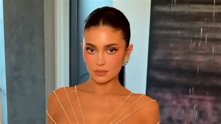 Kylie Jenner Channels Ariana Grande In High Ponytail As She Struts In Orange Mini Dress For Night Out