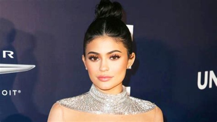 Kylie Jenner Lounges In Sexy Silver Swimsuit While Soaking In The Sun Lakeside