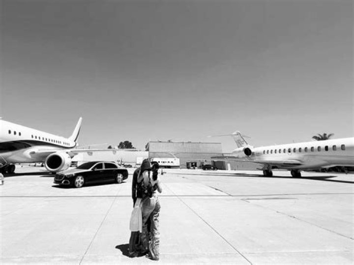 Kylie Jenner Sparks Wedding Rumors By Boarding Plane With Travis Scott & White Gown — Pics