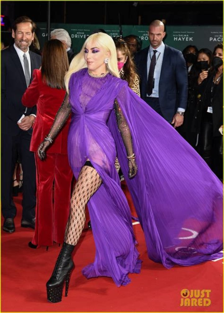 Lady Gaga Slays In Sheer Purple Slit Dress With Fishnets At ‘House of Gucci’ Premiere – Photos