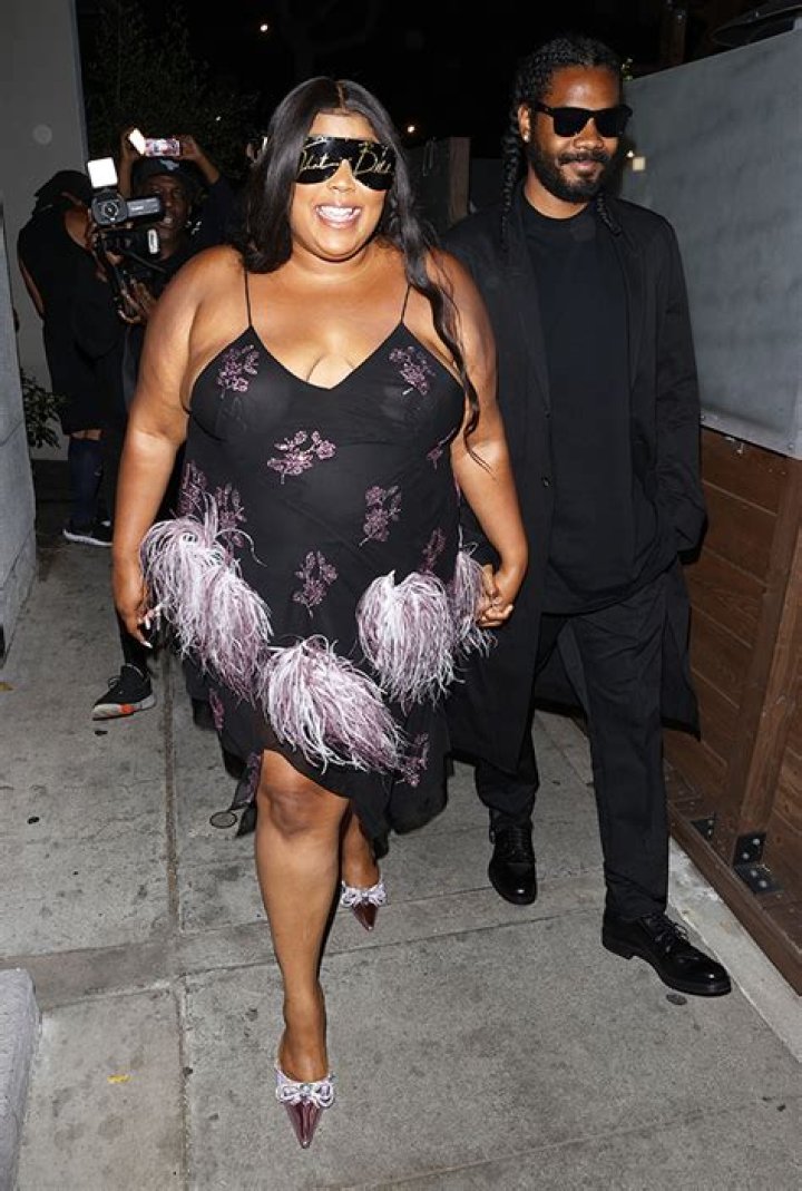 Lizzo Holds Hands With Her Mystery Boyfriend As She Arrives At 34th Birthday Party