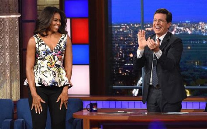 Michelle Obama Reveals Cleavage in Stunning floral Peplum top on Stephen Colbert
