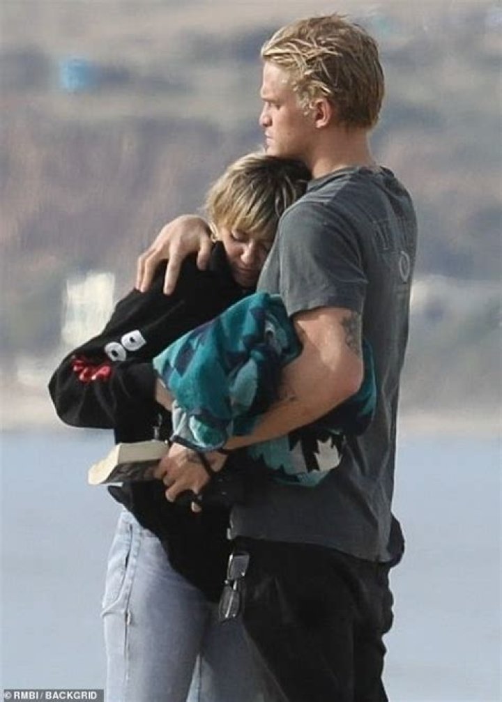Miley Cyrus Cuddles Up To Cody Simpson In Bed As They Play ‘Never Have I Ever’ — Watch