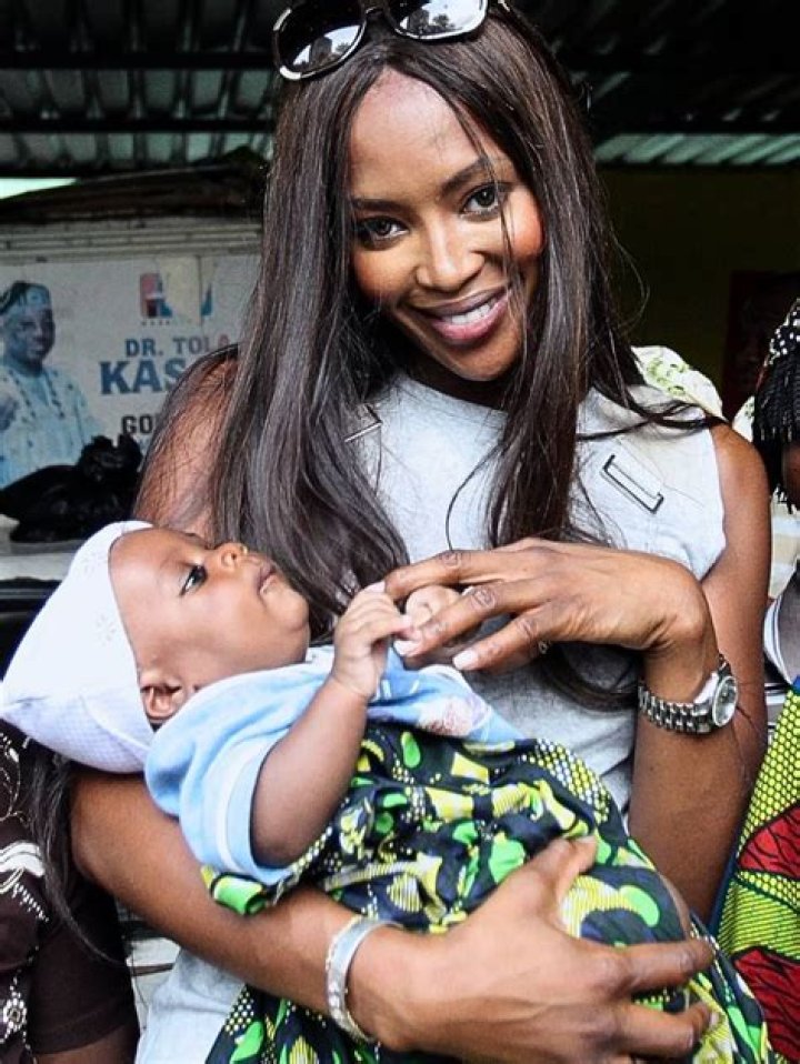 Naomi Campbell Shares Rare, Precious Photo Of Baby Girl Wearing Versace Onesie Worth Over $200