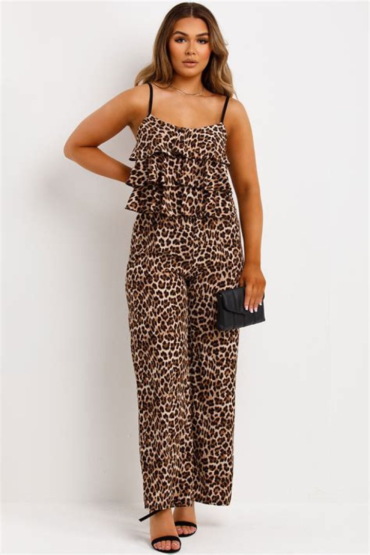 North West, 6, & Penelope Disick, 7, Twin In Animal Print Jumpsuits In Paris