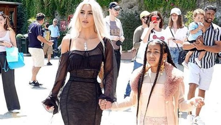 North West Gives Bikini-Clad Mom Kim Kardashian A Piggyback On Beach Vacation: Photos