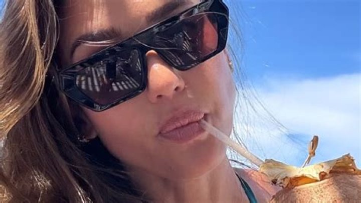 Olivia Culpo Lounges By The Pool & Shows Off Her Abs & Glowing Tan In New Bikini Photo