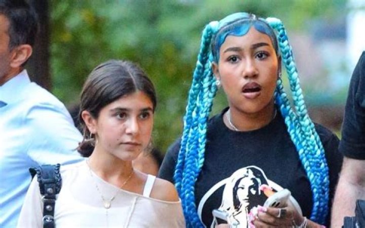 Penelope Disick, 8, Is So Cute Carrying Her Puppy In Cozy Robe Hood — See Pic